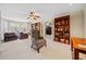 Inviting living room with built-in bookshelves, plush seating, and a view of the backyard at 2007 Woodside Park Dr, Woodstock, GA 30188