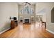 Spacious living room features hardwood floors, a fireplace, and a wall of windows at 2007 Woodside Park Dr, Woodstock, GA 30188