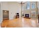 Spacious living room features hardwood floors, a fireplace, and a wall of windows at 2007 Woodside Park Dr, Woodstock, GA 30188