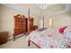 Bright main bedroom with elegant furnishings and decor and carpet flooring at 2007 Woodside Park Dr, Woodstock, GA 30188