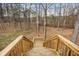 A wooden staircase leading to the backyard and natural surroundings at 4458 Paces Battle Nw, Atlanta, GA 30327