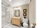 Bright bathroom featuring a light wood vanity, framed mirror, walk-in shower, and neutral walls at 4458 Paces Battle Nw, Atlanta, GA 30327