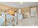 Bedroom featuring two ornate beds with blue comforters and neutral walls at 4458 Paces Battle Nw, Atlanta, GA 30327