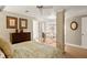 Bright bedroom featuring a decorative metal bed frame and view into sitting room, providing a relaxing and inviting space at 4458 Paces Battle Nw, Atlanta, GA 30327
