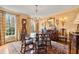 Elegant dining room with hardwood floors, chandelier, and antique furniture at 4458 Paces Battle Nw, Atlanta, GA 30327