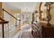 Elegant entryway featuring hardwood floors, ornate mirror, and staircase at 4458 Paces Battle Nw, Atlanta, GA 30327