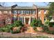 Brick home with black shutters and manicured landscaping at 4458 Paces Battle Nw, Atlanta, GA 30327