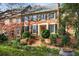 Attractive brick home with lush landscaping, creating curb appeal at 4458 Paces Battle Nw, Atlanta, GA 30327