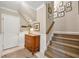 Welcoming foyer with stairs, an accent chest, and tasteful decor, leading to the upper level of the home at 4458 Paces Battle Nw, Atlanta, GA 30327