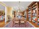 Open-concept kitchen and dining area featuring wooden cabinetry, stainless appliances, and view to dining area and living room at 4458 Paces Battle Nw, Atlanta, GA 30327