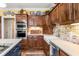 Charming kitchen features wooden cabinets, stainless steel appliances, and a farmhouse-style sink at 4458 Paces Battle Nw, Atlanta, GA 30327