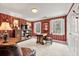 Living room with red striped wallpaper, vintage furniture, and natural light at 4458 Paces Battle Nw, Atlanta, GA 30327