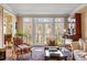 Comfortable living room with large windows, hardwood floors, and stylish furniture at 4458 Paces Battle Nw, Atlanta, GA 30327