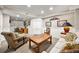 Cozy living room featuring a mix of seating, neutral walls, and built-in storage, creating a warm gathering space at 4458 Paces Battle Nw, Atlanta, GA 30327