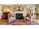 Inviting living room with a fireplace, hardwood floors, and traditional design elements at 4458 Paces Battle Nw, Atlanta, GA 30327