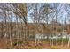 Scenic river view from the backyard, surrounded by trees at 4458 Paces Battle Nw, Atlanta, GA 30327