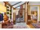 Bright sunroom with wood accents, slate floors, and a glass ceiling leading to an outdoor patio at 4458 Paces Battle Nw, Atlanta, GA 30327