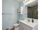 Bright bathroom featuring a white vanity, toilet, and glass-enclosed shower at 1522 Waltham Se Pl, Atlanta, GA 30316