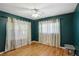 Bedroom with hardwood floors, ceiling fan, and two large windows at 1522 Waltham Se Pl, Atlanta, GA 30316