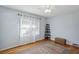 Airy bedroom with hardwood floors, light blue walls and a patterned rug at 1522 Waltham Se Pl, Atlanta, GA 30316