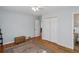 Bedroom with hardwood floors, light blue walls and neutral furnishings at 1522 Waltham Se Pl, Atlanta, GA 30316