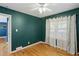 Bright bedroom with hardwood floors, natural light, and fresh paint at 1522 Waltham Se Pl, Atlanta, GA 30316
