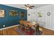 Dining room with hardwood floors, a wooden table, and a view of the outside at 1522 Waltham Se Pl, Atlanta, GA 30316