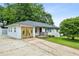 Charming single-story home featuring white painted brick and a well-maintained front yard at 1522 Waltham Se Pl, Atlanta, GA 30316