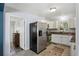 Updated kitchen features stainless steel appliances and white cabinets and granite countertops at 1522 Waltham Se Pl, Atlanta, GA 30316
