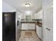 Well-lit kitchen featuring white cabinetry, stainless appliances, and modern countertops at 1522 Waltham Se Pl, Atlanta, GA 30316