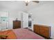 Cozy bedroom with warm lighting and views into the bathroom and laundry room at 1522 Waltham Se Pl, Atlanta, GA 30316