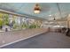 Large screened-in porch with ceiling fan and views of the backyard at 1522 Waltham Se Pl, Atlanta, GA 30316