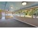 Spacious screened porch with ceiling fans overlooking the backyard at 1522 Waltham Se Pl, Atlanta, GA 30316