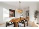 Bright dining room with modern light fixture, and stylish furniture at 4555 Mystic Dr, Atlanta, GA 30342