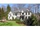 Beautiful two-story home showcasing black frame windows, manicured lawn and well-maintained landscaping at 4555 Mystic Dr, Atlanta, GA 30342