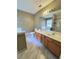 Bright bathroom with double sinks, a large mirror, and marble-look tile floors at 985 James Ridge Dr, Lawrenceville, GA 30045