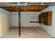 Unfinished basement with shelving and storage at 10155 Twin Oaks Sw Dr, Covington, GA 30014