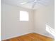 Bright bedroom featuring hardwood floors and a ceiling fan at 10155 Twin Oaks Sw Dr, Covington, GA 30014
