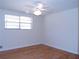 Bright bedroom with hardwood floors and ceiling fan at 10155 Twin Oaks Sw Dr, Covington, GA 30014