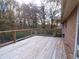 Wooden deck with wire railing and wooded view at 10155 Twin Oaks Sw Dr, Covington, GA 30014