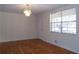 Dining room with hardwood floors, chandelier and window at 10155 Twin Oaks Sw Dr, Covington, GA 30014