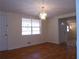 Dining room with hardwood floors, chandelier and view to kitchen at 10155 Twin Oaks Sw Dr, Covington, GA 30014