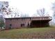 Brick house with a deck and large backyard at 10155 Twin Oaks Sw Dr, Covington, GA 30014