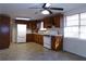 Kitchen with wood cabinets, white appliances and tile floor at 10155 Twin Oaks Sw Dr, Covington, GA 30014