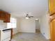 Kitchen features wood cabinets and tile floor at 10155 Twin Oaks Sw Dr, Covington, GA 30014
