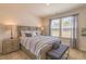 This bedroom features a cozy bed, natural light, and side tables, offering a comfortable retreat at 257 Orwell Dr, Social Circle, GA 30025