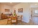Charming dining area with a wooden table set and decorative wall art at 257 Orwell Dr, Social Circle, GA 30025