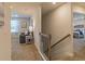 Upstairs hallway leading to a cozy living area and bedroom at 257 Orwell Dr, Social Circle, GA 30025