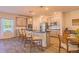 Bright kitchen featuring an island, stainless steel appliances, and a breakfast bar at 257 Orwell Dr, Social Circle, GA 30025