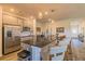 Spacious kitchen with stainless steel appliances, a large island, and pendant lighting at 257 Orwell Dr, Social Circle, GA 30025